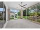 Screened lanai with neutral tones offering an inviting space for relaxation and outdoor living at 26111 Feathersound Dr, Punta Gorda, FL 33955