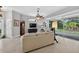 A view of the living room featuring neutral colors and a ceiling fan at 26111 Feathersound Dr, Punta Gorda, FL 33955