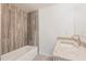 Modern bathroom with decorative tile accent wall, granite counter top, and chrome faucet at 27128 Aloha Dr, Punta Gorda, FL 33955
