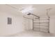 Bright white garage with garage door and white door at 27128 Aloha Dr, Punta Gorda, FL 33955