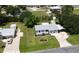 An aerial shot shows the house, manicured lawn, driveway, carport, and landscaping at 2805 Gussie St, Punta Gorda, FL 33950