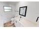 Modern bathroom featuring a vanity, new fixtures, stylish mirror, and bathtub, creating a spa-like atmosphere at 2805 Gussie St, Punta Gorda, FL 33950
