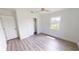 Well-lit bedroom offers a window and closet, complemented by wood-look floors and white walls for a cozy, minimalist design at 2805 Gussie St, Punta Gorda, FL 33950