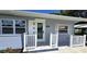 Close up of the charming front porch of the home with detailed trim and brick accents at 2805 Gussie St, Punta Gorda, FL 33950