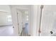 Bright hallway featuring wood floors and white trim, connecting living spaces and creating an airy and modern feel at 2805 Gussie St, Punta Gorda, FL 33950