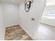 Small laundry room featuring washer/dryer hookups, new floors, and clean, bright walls at 2805 Gussie St, Punta Gorda, FL 33950