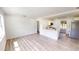 Open concept living room with new floors adjacent to the modern kitchen with island at 2805 Gussie St, Punta Gorda, FL 33950