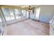 Enclosed sunroom features stone floors and large windows, allowing for plenty of natural light and indoor/outdoor living at 2805 Gussie St, Punta Gorda, FL 33950