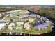 The community features a tennis court, pool, and boat docks, with beautiful landscaping and water views at 3256 White Ibis Ct # 24A, Punta Gorda, FL 33950