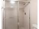 This bathroom features a tiled shower with glass doors and a built in toiletry shelf at 3256 White Ibis Ct # 24A, Punta Gorda, FL 33950
