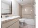 This neutral bathroom features a single sink vanity, tiled floors, and shower with grab bar at 3256 White Ibis Ct # 24A, Punta Gorda, FL 33950
