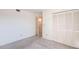 This bedroom features neutral carpeting, bright white walls, closet with folding doors and an open doorway at 3256 White Ibis Ct # 24A, Punta Gorda, FL 33950