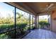 Relax on this screened lanai with views of a scenic canal at 3256 White Ibis Ct # 24A, Punta Gorda, FL 33950