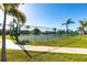 Well-maintained tennis courts surrounded by mature palm trees at 3256 White Ibis Ct # 24A, Punta Gorda, FL 33950