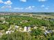 Scenic aerial view of the home's location surrounded by lush greenery and waterways under a blue sky at 3616 Allapatchee Dr, Punta Gorda, FL 33950
