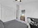 Bedroom featuring a closet, ceiling fan, a desk and chair and a view of a TV at 3616 Allapatchee Dr, Punta Gorda, FL 33950