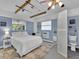 Cozy bedroom featuring a bed, closet, and fishing rods hanging from the ceiling at 3616 Allapatchee Dr, Punta Gorda, FL 33950