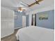Cozy bedroom featuring a bed, closet, and fishing rods hanging from the ceiling at 3616 Allapatchee Dr, Punta Gorda, FL 33950