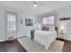 Bright bedroom with a queen-sized bed, light walls and flooring, and modern decor at 3616 Allapatchee Dr, Punta Gorda, FL 33950