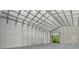 The interior of a large metal building features a tall ceiling and open door at 3616 Allapatchee Dr, Punta Gorda, FL 33950