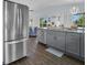 Modern kitchen with stainless steel fridge, granite countertops and an open design at 3616 Allapatchee Dr, Punta Gorda, FL 33950