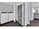 Bright laundry area with modern washer and dryer and stainless steel fridge at 3616 Allapatchee Dr, Punta Gorda, FL 33950