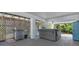 Outdoor living area featuring a grill, hot tub, and views of the surrounding area at 3616 Allapatchee Dr, Punta Gorda, FL 33950