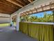Covered patio with counter top and bar, grill, and waterfront views of the property at 3616 Allapatchee Dr, Punta Gorda, FL 33950