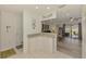 Open living space with a view to the kitchen and sliding doors leading to an outdoor area at 4044 S Salford Blvd, North Port, FL 34287