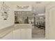 Spacious floor plan showcases the breakfast bar to the living room and outdoor spaces at 4044 S Salford Blvd, North Port, FL 34287