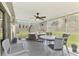 Cozy patio featuring a jacuzzi, a ceiling fan, and a comfortable sitting area at 4044 S Salford Blvd, North Port, FL 34287