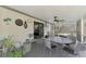 A view of a screened-in patio with seating and a hot tub, great for entertaining at 4044 S Salford Blvd, North Port, FL 34287