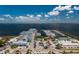 Breathtaking aerial view of a marina with ample boat parking and waterfront dining with stunning views at 4089 Yucatan Cir, Port Charlotte, FL 33948