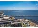 Expansive aerial view of a coastal city featuring a long bridge spanning over the water, connecting to the mainland at 4089 Yucatan Cir, Port Charlotte, FL 33948