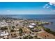 Panoramic aerial view of a vibrant coastal town, showcasing tree-lined streets, waterways, and diverse architecture at 4089 Yucatan Cir, Port Charlotte, FL 33948