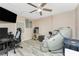 Bonus room with a ceiling fan, TV, and massage chair at 4089 Yucatan Cir, Port Charlotte, FL 33948