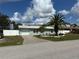 Charming single-story home with well-maintained landscaping and a driveway at 4089 Yucatan Cir, Port Charlotte, FL 33948