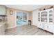 Kitchen with sliding door access to pool, adjacent to a vintage china cabinet, creating a cozy space at 4089 Yucatan Cir, Port Charlotte, FL 33948