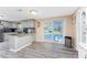 Kitchen featuring stainless steel appliances and granite countertops, seamlessly connecting to the outdoor pool area at 4089 Yucatan Cir, Port Charlotte, FL 33948