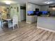 Open-concept kitchen and dining area with updated appliances, a breakfast bar, and stylish decor at 4089 Yucatan Cir, Port Charlotte, FL 33948