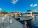 Waterfront property featuring a private boat dock with ample space for yachts and other watercraft at 4089 Yucatan Cir, Port Charlotte, FL 33948