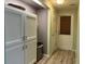 Mud room featuring floor to ceiling cabinet storage and door to exterior at 4089 Yucatan Cir, Port Charlotte, FL 33948