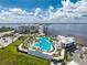 Aerial view of a resort-style community pool and beautiful landscaping at 4089 Yucatan Cir, Port Charlotte, FL 33948