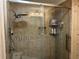 Luxurious shower with tile surround, glass door, and multiple shower heads at 4089 Yucatan Cir, Port Charlotte, FL 33948
