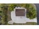 Overhead view of home showing roof, cracked driveway, and surrounding mature trees at 4317 Mccullough St, Port Charlotte, FL 33948