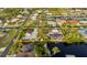 Stunning aerial view of a waterfront property featuring a spacious yard and a private dock at 4317 Mccullough St, Port Charlotte, FL 33948