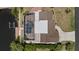 Aerial view of property with a screened pool, boat dock, and lush backyard at 4317 Mccullough St, Port Charlotte, FL 33948