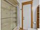 Shower and toilet in bathroom with tile floor and decorative trim near shower at 4317 Mccullough St, Port Charlotte, FL 33948