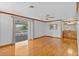 Light filled bedroom with light trim and hardwood floors, with access to a deck at 4317 Mccullough St, Port Charlotte, FL 33948