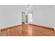 A bedroom with hardwood floors, ceiling fan, and a window with sheer curtains at 4317 Mccullough St, Port Charlotte, FL 33948